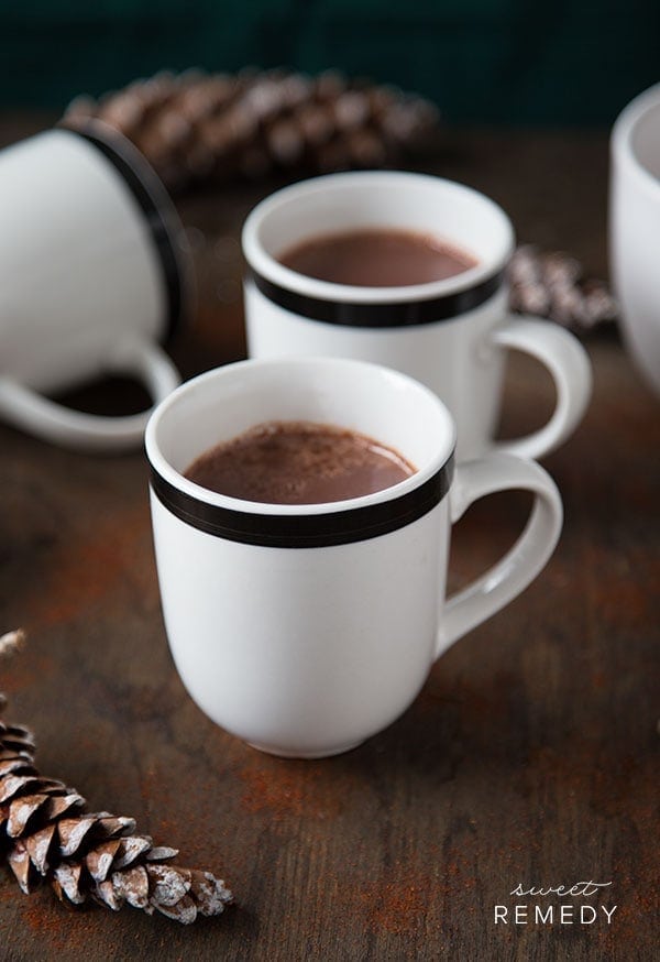 white cups filled with brown hot chocolate.