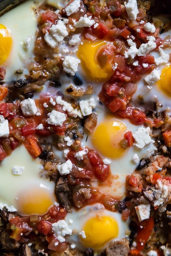 salsa, eggs, feta cheese in cast iron skillet