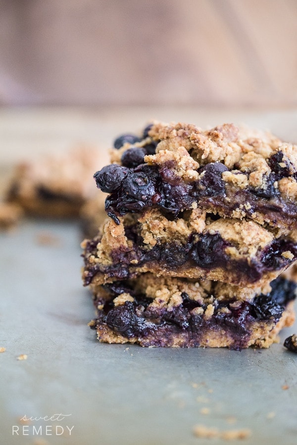 Blueberry Crumb Bars stacked on top of each other.