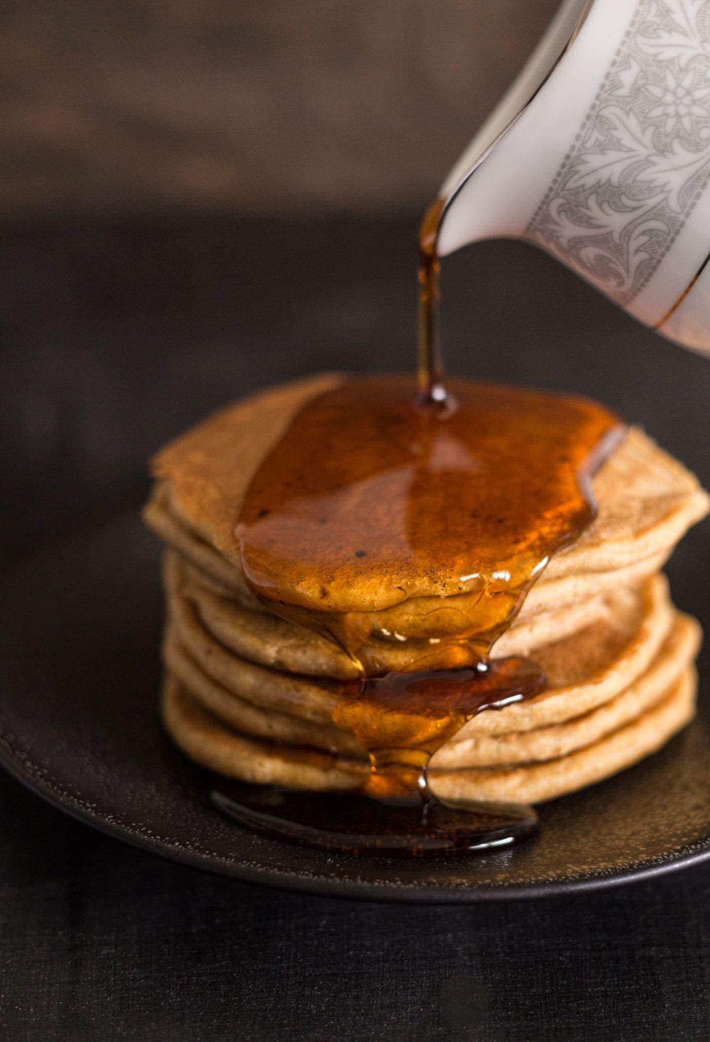 Stack of pumpkin spice pancakes with syrup