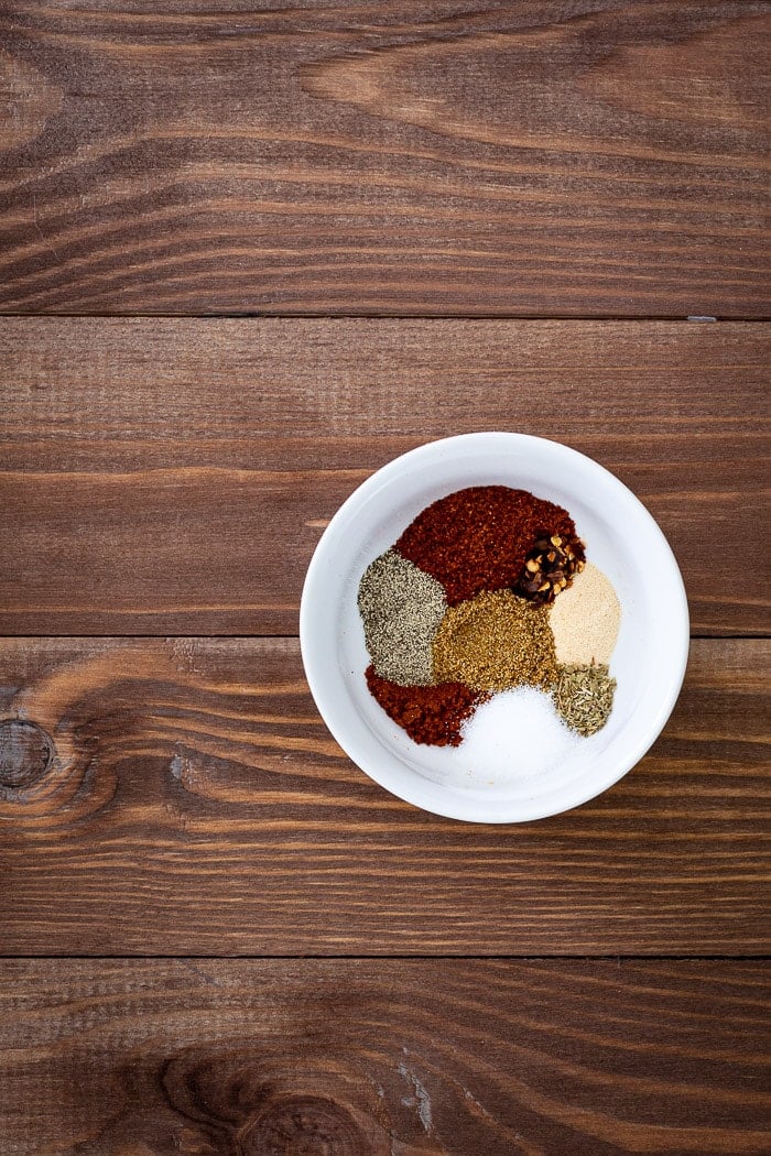 small white bowl with various spices.