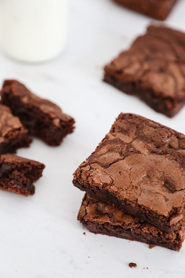 brownies on marble with milk glass